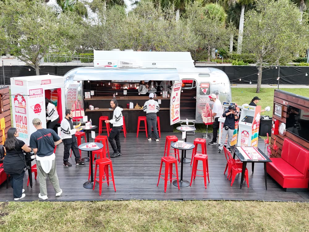 Airstream bar activation with lounge seating at an outdoor event