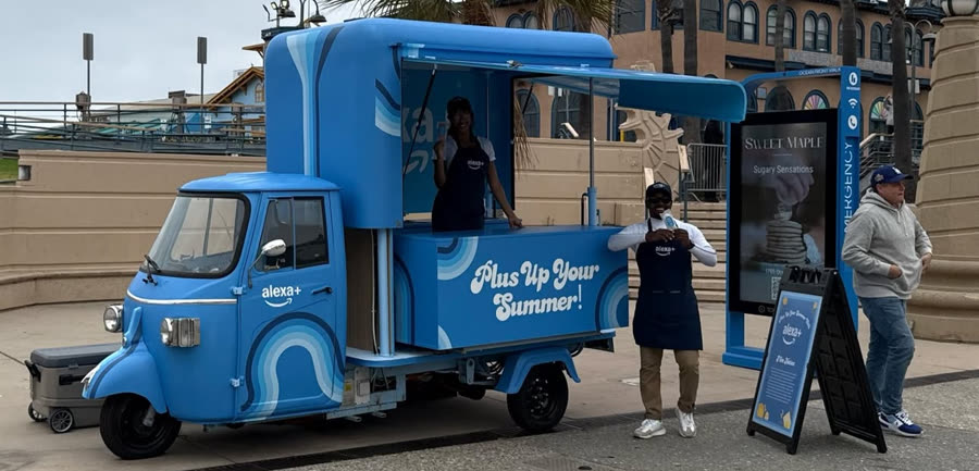 Piaggio Ape activation on an oceanfront boardwalk